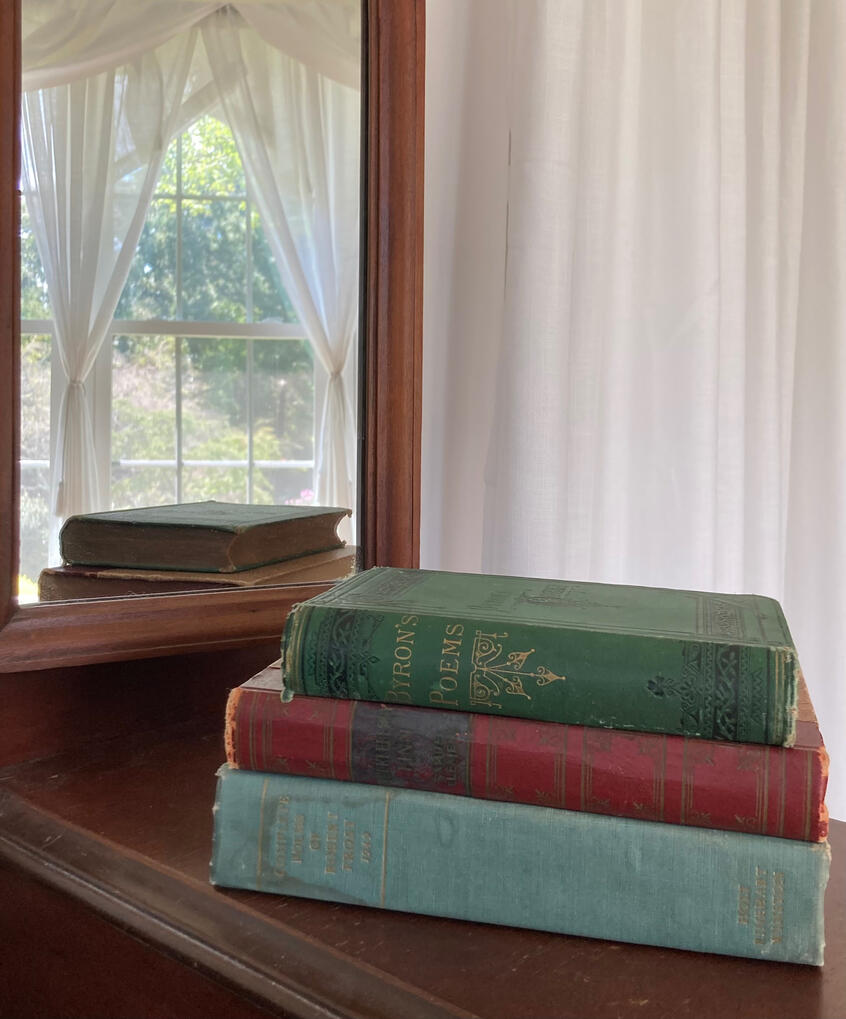 Books on a Vanity Table Three Books Stacked on a Vanity Table